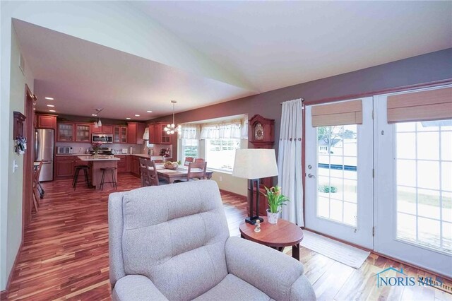 501 Flintlock Ct, Findlay, OH 45840 - living area featuring wood finished floors, a chandelier, and recessed lighting