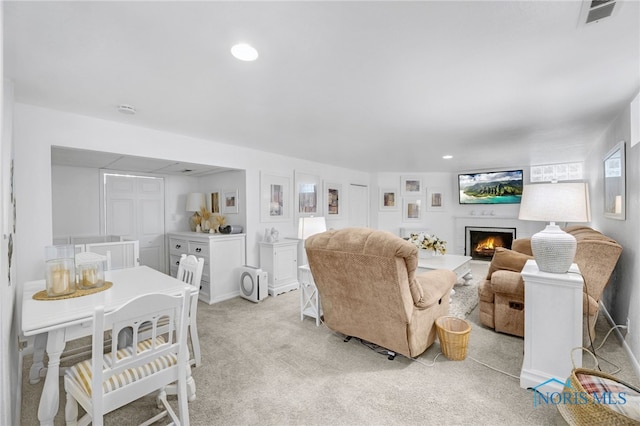 2324 Secor Rd, Toledo, OH 43606 - living area with a fireplace, light colored carpet, recessed lighting, and baseboards