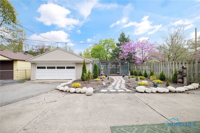 2324 Secor Rd, Toledo, OH 43606 - view of front of house with a garage and an outbuilding