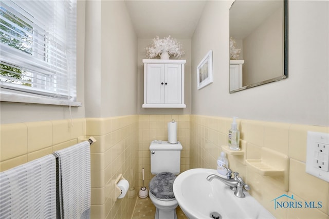 2324 Secor Rd, Toledo, OH 43606 - bathroom featuring a sink, wainscoting, toilet, and tile walls