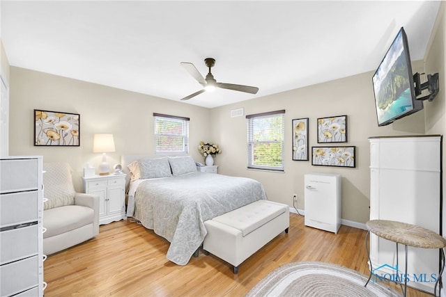 2324 Secor Rd, Toledo, OH 43606 - bedroom with light wood-style floors, ceiling fan, and baseboards