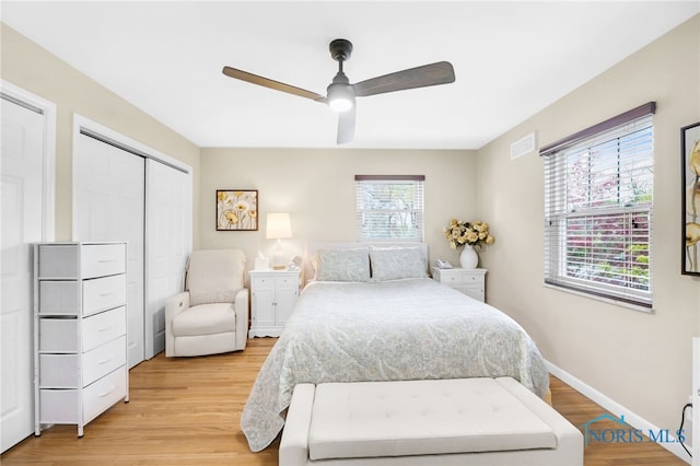2324 Secor Rd, Toledo, OH 43606 - bedroom featuring light wood-style flooring, a closet, ceiling fan, and baseboards
