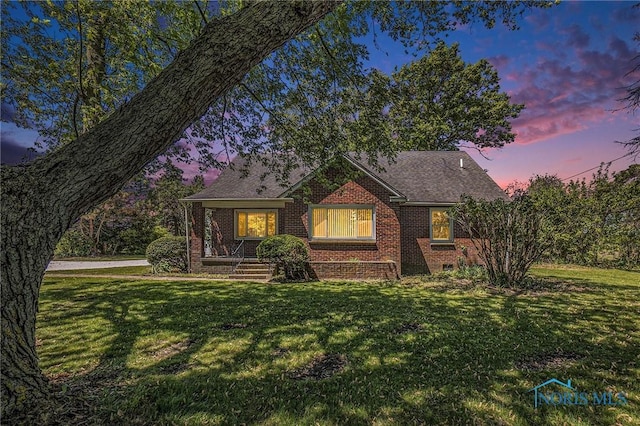 26331 Pemberville Rd, Perrysburg, OH 43551 - view of front of house featuring brick siding and a yard