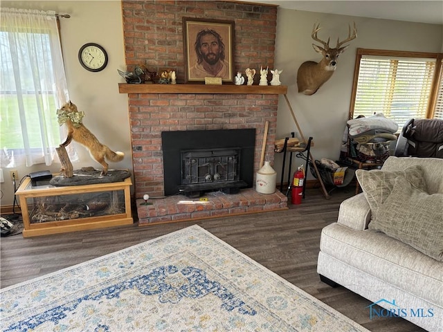 5412 Evansport Rd, Defiance, OH 43512 - living area featuring wood finished floors, healthy amount of natural light, and a fireplace