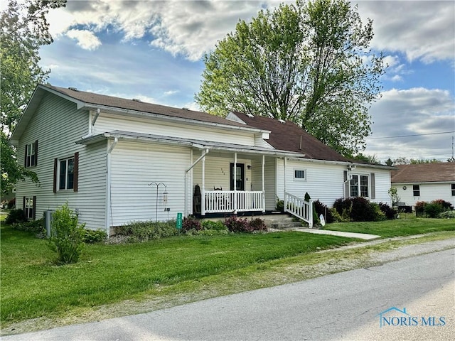203 Washington St, Bettsville, OH 44815 - view of front of home featuring a porch and a front yard