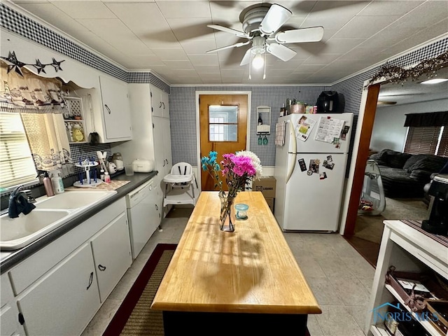 203 Washington St, Bettsville, OH 44815 - kitchen with white appliances, a sink, butcher block countertops, ceiling fan, and white cabinets