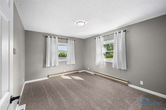 1473 State Route 66, Stryker, OH 43557 - spare room with a baseboard radiator, plenty of natural light, and carpet