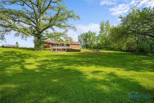 1473 State Route 66, Stryker, OH 43557 - view of grassy yard with a wooden deck