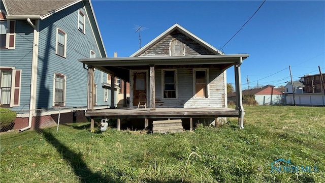 626 Walnut St, Toledo, OH 43604 - back of property with covered porch and a yard