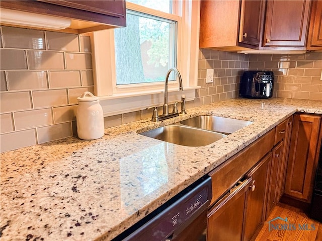 348 S 8th St, Upper Sandusky, OH 43351 - kitchen featuring brown cabinetry, tasteful backsplash, light stone countertops, and dishwasher