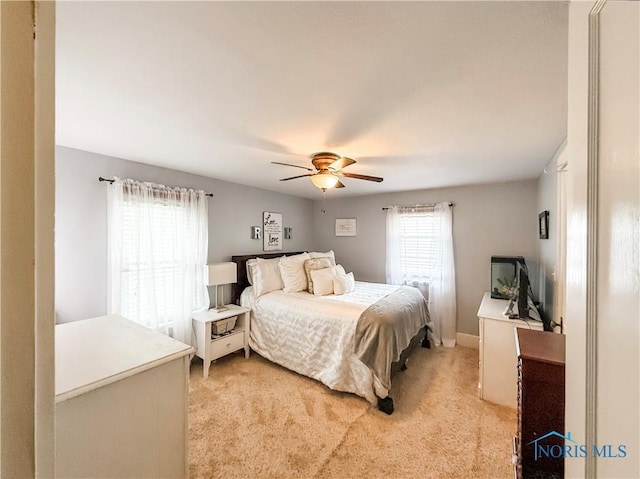 348 S 8th St, Upper Sandusky, OH 43351 - bedroom with light colored carpet and a ceiling fan