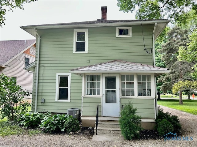 348 S 8th St, Upper Sandusky, OH 43351 - rear view of property featuring entry steps and a chimney