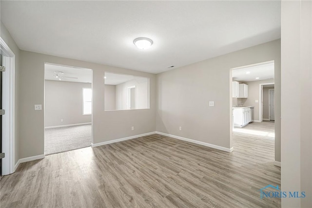 145 E Crocker St, Fostoria, OH 44830 - spare room with light wood-style flooring and baseboards