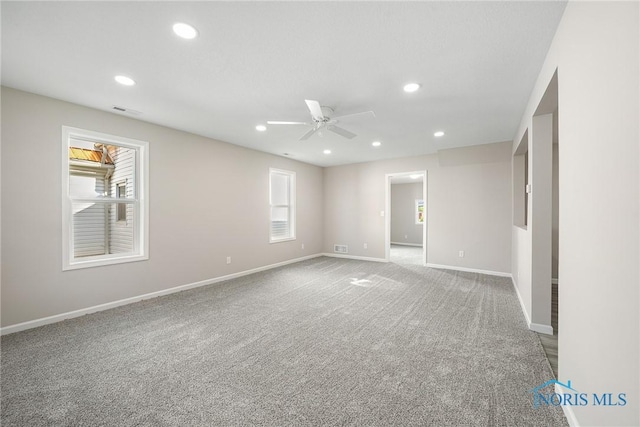 145 E Crocker St, Fostoria, OH 44830 - carpeted empty room with a ceiling fan, recessed lighting, and baseboards