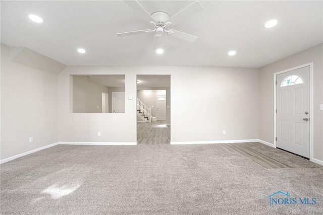 145 E Crocker St, Fostoria, OH 44830 - foyer featuring carpet, baseboards, stairs, and recessed lighting