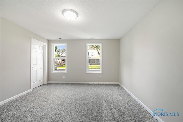 145 E Crocker St, Fostoria, OH 44830 - empty room with carpet and baseboards