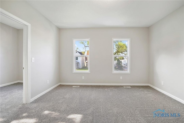 145 E Crocker St, Fostoria, OH 44830 - unfurnished room featuring carpet flooring and baseboards