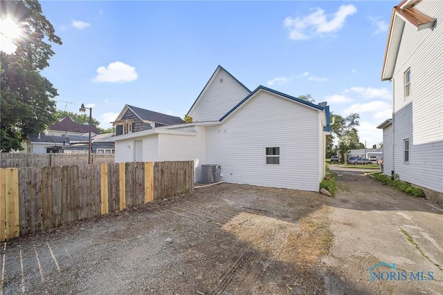 145 E Crocker St, Fostoria, OH 44830 - view of side of home with cooling unit