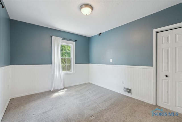 2904 Goddard Rd, Toledo, OH 43606 - carpeted spare room featuring a wainscoted wall