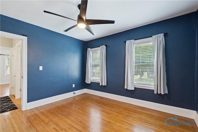 2904 Goddard Rd, Toledo, OH 43606 - unfurnished room featuring wood finished floors, ceiling fan, and baseboards