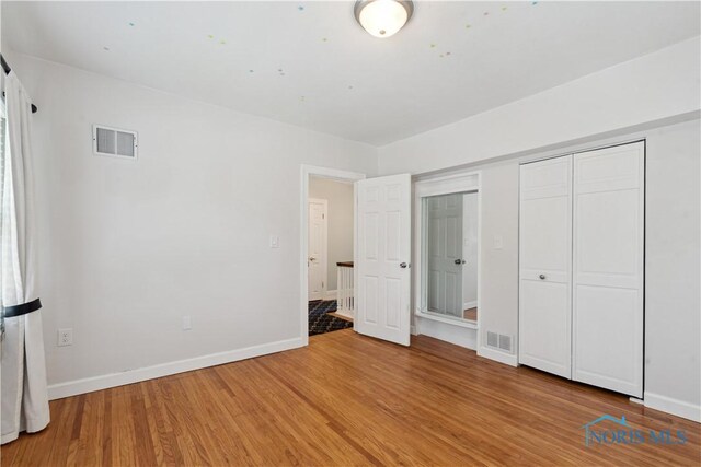 2904 Goddard Rd, Toledo, OH 43606 - unfurnished bedroom with light wood-style floors and baseboards