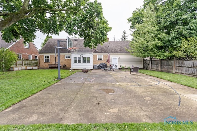 2838 Secor Rd, Toledo, OH 43606 - rear view of house with brick siding, a shingled roof, and a patio area