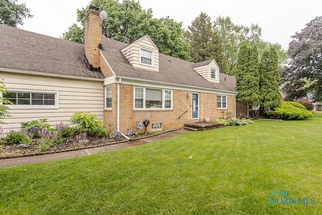 2838 Secor Rd, Toledo, OH 43606 - cape cod house featuring a front lawn, brick siding, a chimney, and roof with shingles