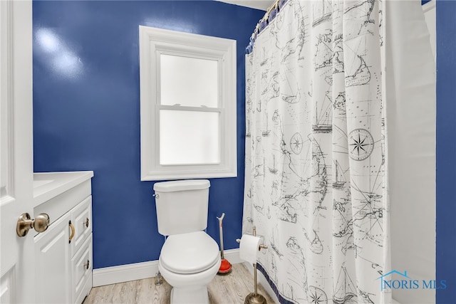 502 W 6th St, Perrysburg, OH 43551 - bathroom with wood finished floors, baseboards, toilet, and vanity
