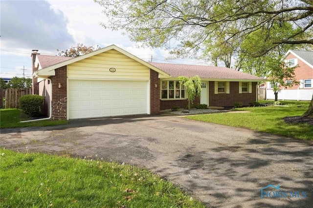 1816 Cherry Ln, Findlay, OH 45840 - single story home with brick siding, driveway, an attached garage, and a chimney