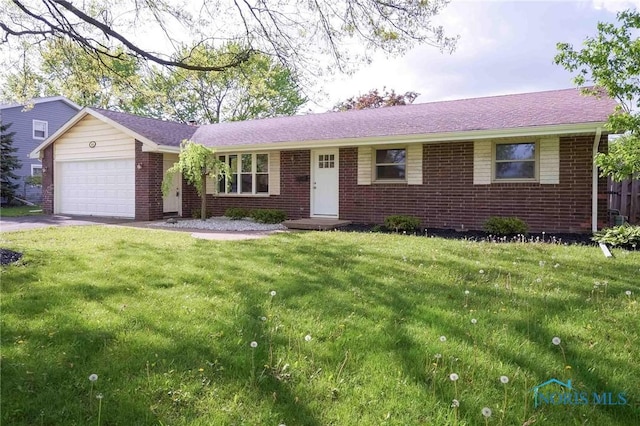 1816 Cherry Ln, Findlay, OH 45840 - ranch-style home featuring brick siding, a garage, and a front lawn