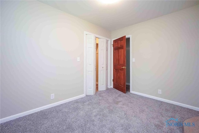 1816 Cherry Ln, Findlay, OH 45840 - unfurnished bedroom with carpet and baseboards
