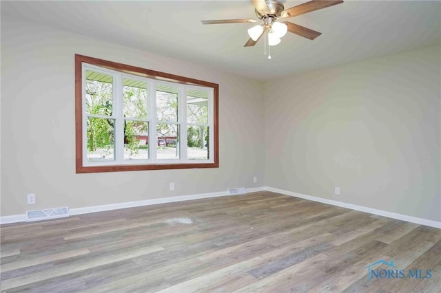 1816 Cherry Ln, Findlay, OH 45840 - empty room with ceiling fan, wood finished floors, and baseboards