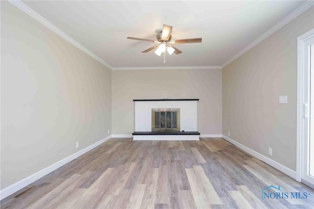 1816 Cherry Ln, Findlay, OH 45840 - unfurnished living room featuring a ceiling fan, wood finished floors, a glass covered fireplace, baseboards, and ornamental molding