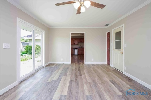 1816 Cherry Ln, Findlay, OH 45840 - spare room with a ceiling fan, ornamental molding, light wood-style flooring, and baseboards