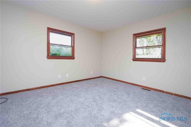 1816 Cherry Ln, Findlay, OH 45840 - carpeted empty room with healthy amount of natural light and baseboards