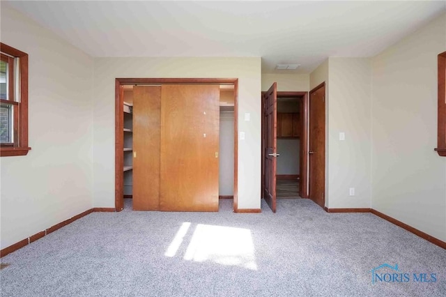 1816 Cherry Ln, Findlay, OH 45840 - unfurnished bedroom featuring carpet floors, baseboards, and a closet
