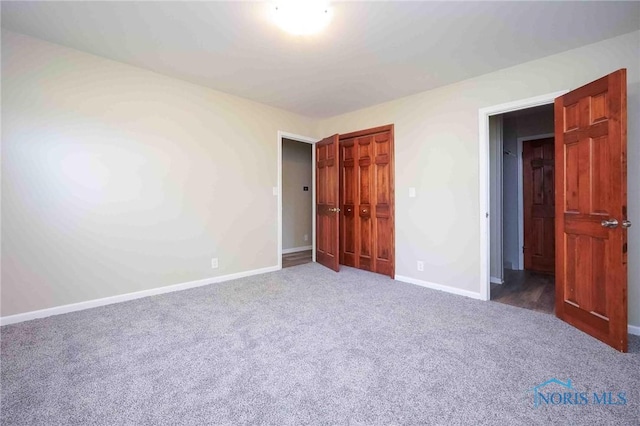 1816 Cherry Ln, Findlay, OH 45840 - unfurnished bedroom featuring carpet flooring, baseboards, and a closet