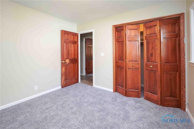 1816 Cherry Ln, Findlay, OH 45840 - unfurnished bedroom featuring carpet floors, baseboards, and a closet