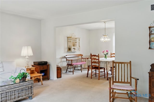 2009 Saratoga Dr, Findlay, OH 45840 - dining space featuring carpet floors and a chandelier