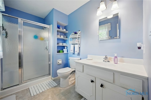 2009 Saratoga Dr, Findlay, OH 45840 - full bathroom featuring toilet, a stall shower, vanity, and tile patterned floors