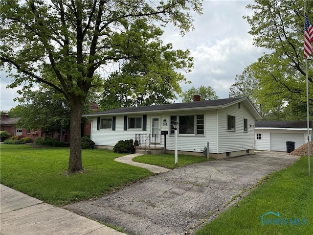 514 E Indiana, Maumee, OH 43537 - single story home with an outbuilding, a front yard, a chimney, and driveway