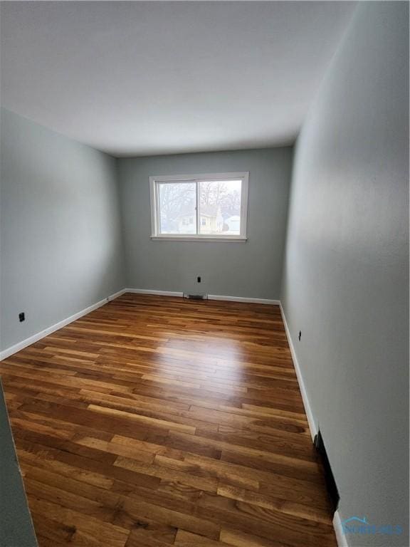 514 E Indiana, Maumee, OH 43537 - spare room with wood finished floors and baseboards