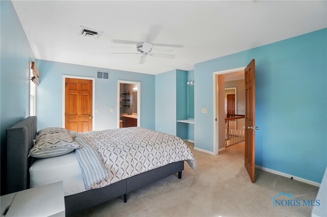 1301 Forest Park, Findlay, OH 45840 - bedroom featuring light colored carpet, baseboards, a ceiling fan, and ensuite bath