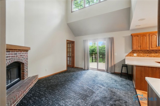 1301 Forest Park, Findlay, OH 45840 - unfurnished living room featuring plenty of natural light, carpet, a high ceiling, and baseboards