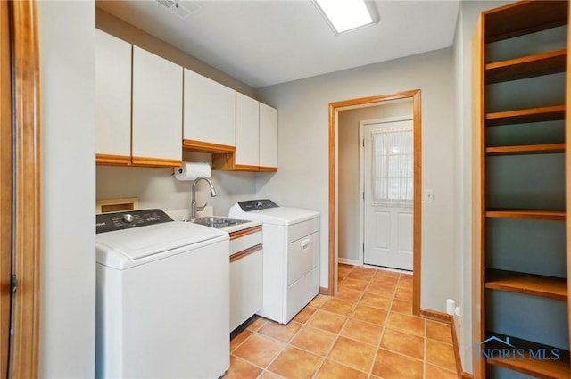 1301 Forest Park, Findlay, OH 45840 - laundry room with cabinet space, washer and clothes dryer, and light tile patterned floors