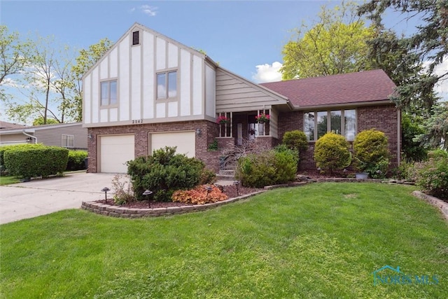 2142 Tracy Rd, Northwood, OH 43619 - view of front of house featuring brick siding, a garage, driveway, and a front lawn