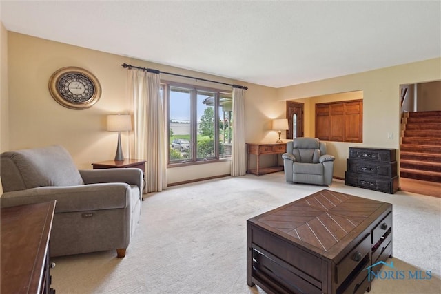 2142 Tracy Rd, Northwood, OH 43619 - living room featuring light carpet and stairway