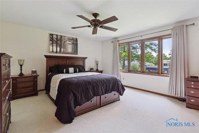 2142 Tracy Rd, Northwood, OH 43619 - bedroom with light carpet, baseboards, and ceiling fan
