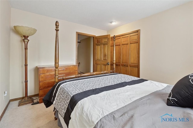 2142 Tracy Rd, Northwood, OH 43619 - carpeted bedroom with a closet and baseboards