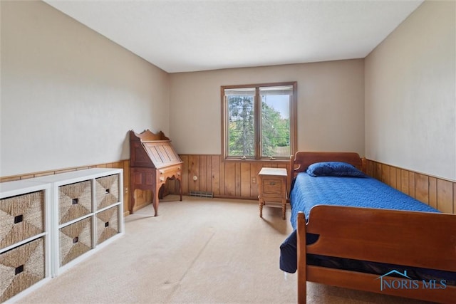 2142 Tracy Rd, Northwood, OH 43619 - bedroom with wood walls, a wainscoted wall, and carpet